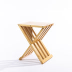Solace Hale Bamboo Folding Stool Natural shown open on a white background with a slatted top and folding X-frame design.