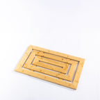 Solace Hale Bamboo Bathmat Natural shown flat on a white background with a geometric slatted bamboo design.