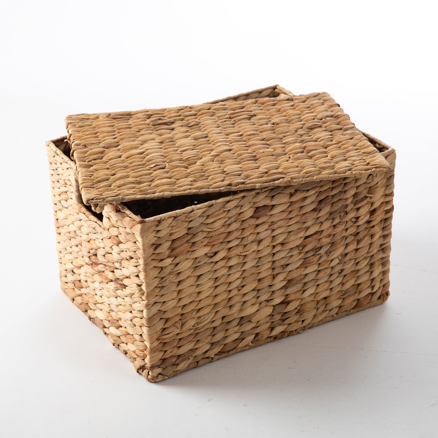 Natural water hyacinth woven cube storage basket with a matching fitted lid, shown partially open with integrated cut-out side handles.