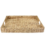 Rectangular natural water hyacinth woven tray with integrated side handles and a braided textured finish.