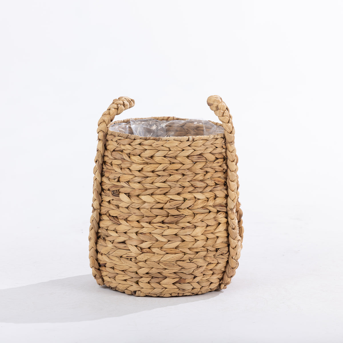 Natural woven basket with braided handles and a clear inner liner, shown against a white background.