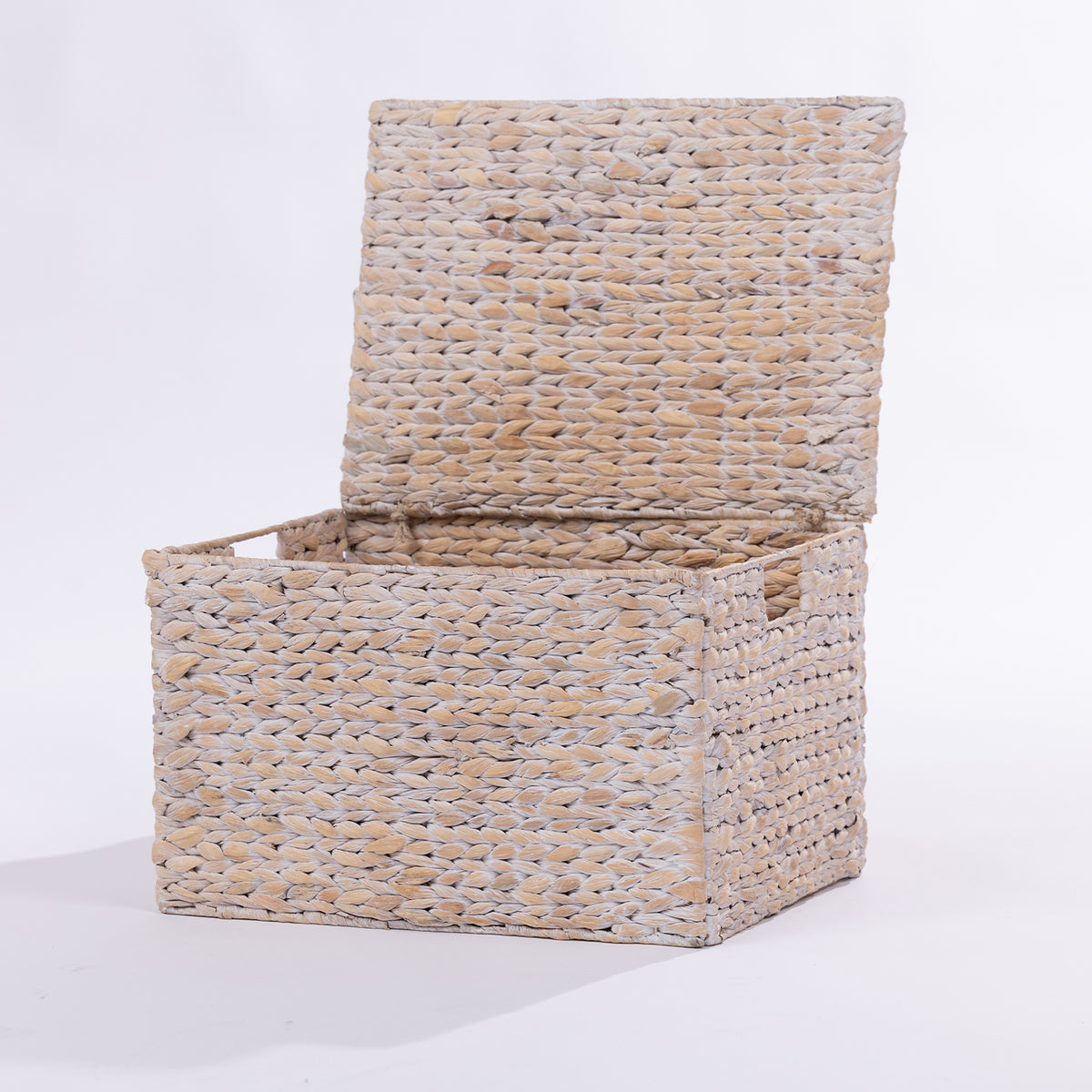 A rectangular woven storage basket with a hinged lid, made from natural beige and light gray fibers, shown open on a white background.