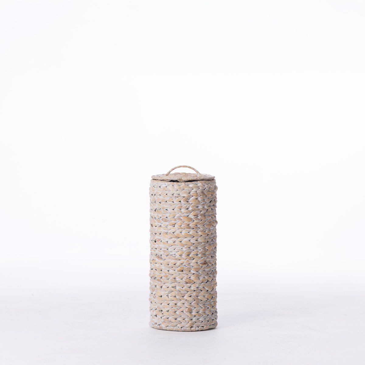 Cove Wilder Roll Holder in White Wash, featuring a tall cylindrical woven design with a fitted lid and carry loop.