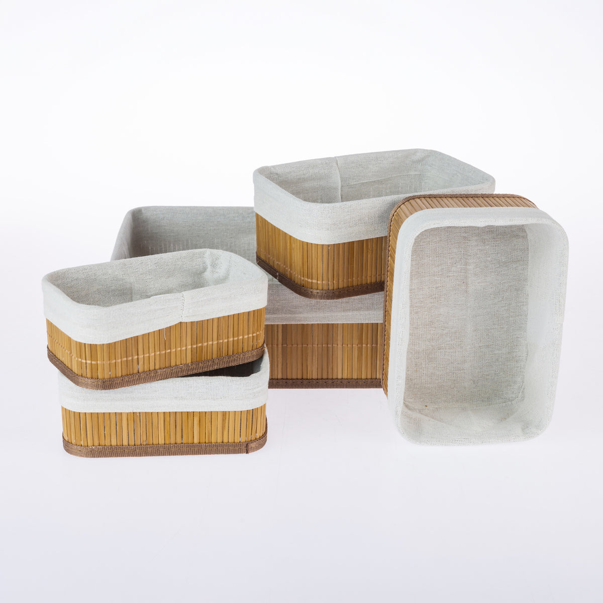 Home Co. Ashton 5 Piece Bamboo Basket Set in Natural, featuring five rectangular bamboo storage baskets with brown trim and soft fabric linings, arranged together on a white background.