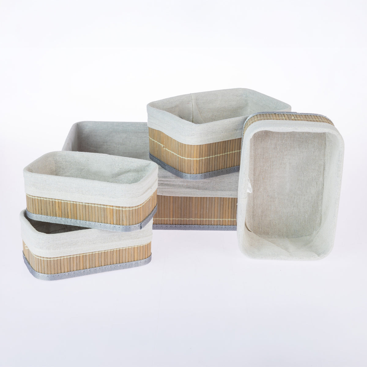 Home Co. Ashton 5 Piece Bamboo Basket Set in Grey, featuring five rectangular bamboo storage baskets with grey trim and soft fabric linings, arranged together on a white background.