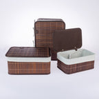 Home Co. Ashton Bamboo Storage Basket Set with Lids in Brown, featuring rectangular bamboo baskets with dark brown trim, cream fabric linings and matching lids, displayed open and closed on a white background.