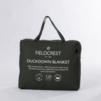 A premium feather and down blanket neatly packed in a soft carry bag, featuring a luxurious cotton cover, satin border, and plush duck down fill for lightweight warmth.