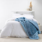 Blue Cotton/Faux Fur Blanket on styled bed