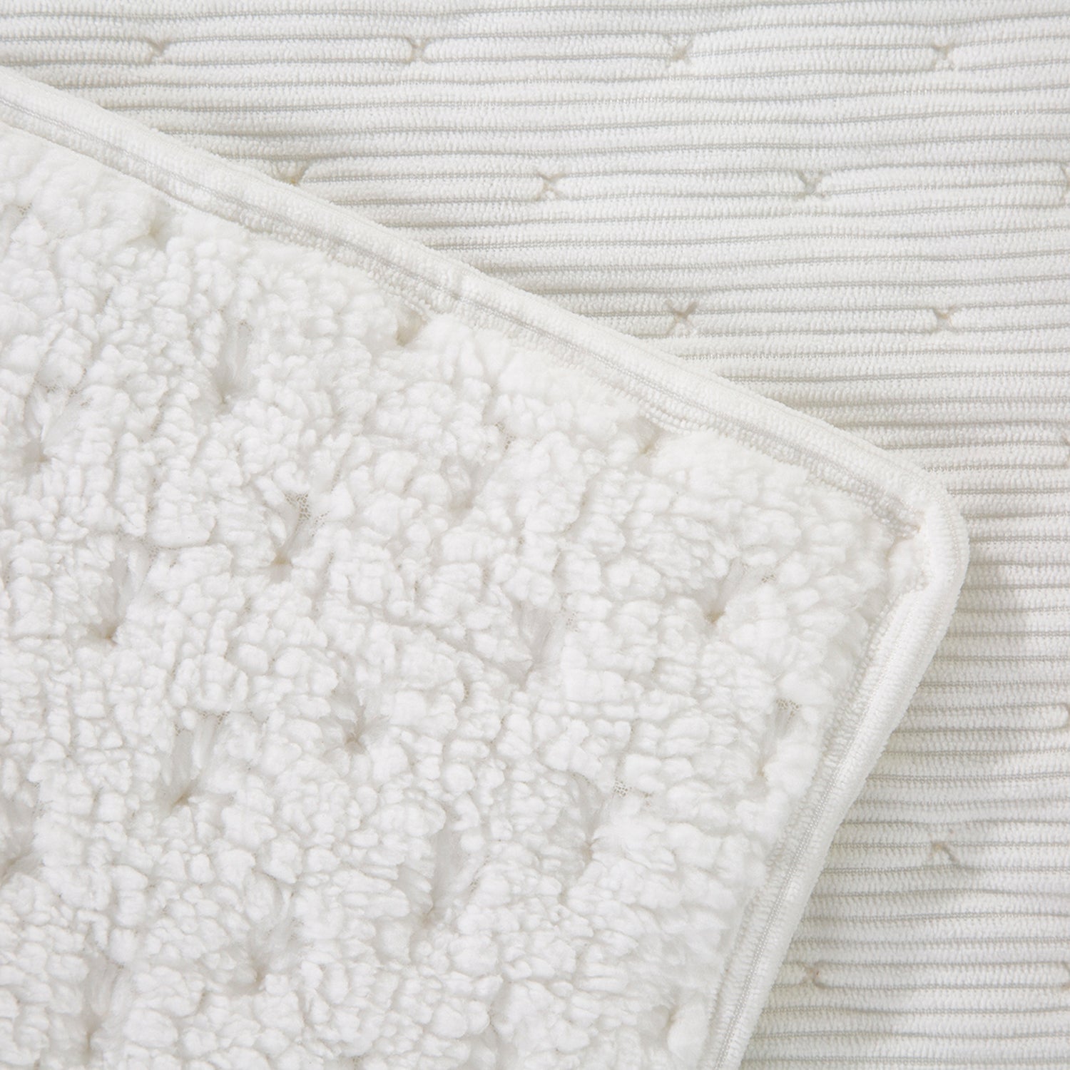 Front & reverse close up swatch of white blanket