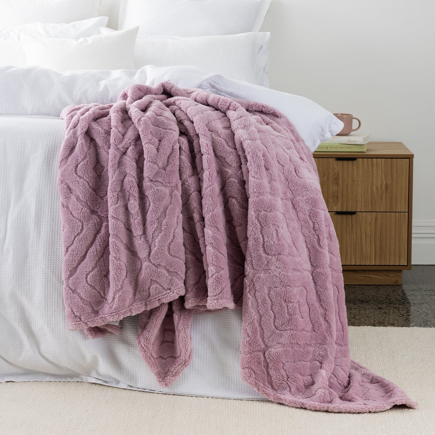 Lilac Colour Embossed fleece blanket styled on the end of bed