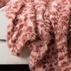 Pink faux fur blanket up close