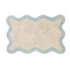 Pale blue wavy bathmat featuring a soft two-tone border design on a clean white background.