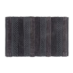 Charcoal bathmat featuring a textured stripe design with plush and bobble detailing on a clean white background.