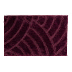 Berry bathmat featuring a plush carved geometric pattern on a clean white background.
