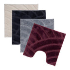 Bathmat and contour mat range featuring plush carved geometric designs in berry, black, cream, and grey colourways on a clean white background.
