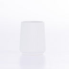 Matte White ribbed bathroom tumbler with a tapered silhouette, displayed on a white background.