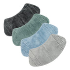 Four curved striped shower mats in coal, sea mist, pale blue, and grey on a white background.
