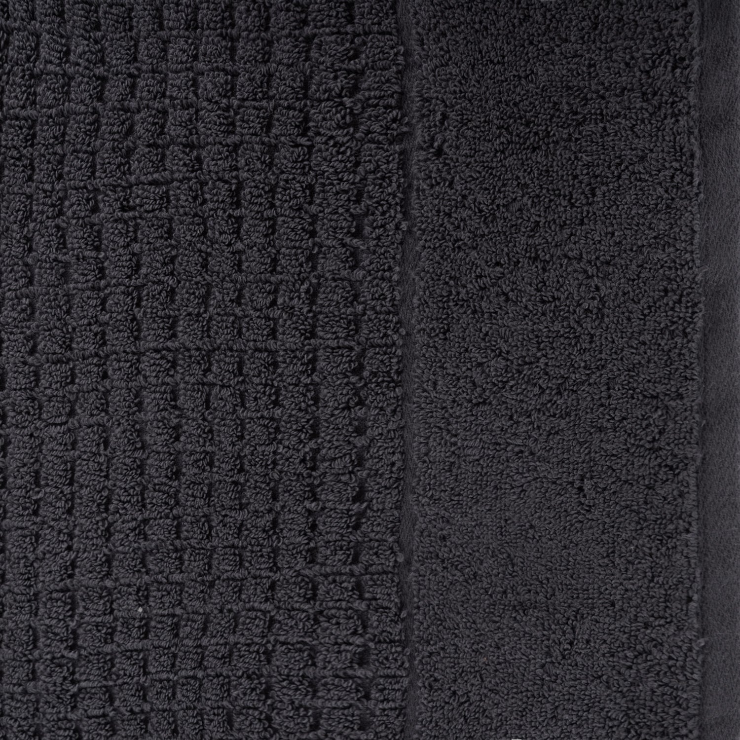 Close-up of charcoal Fieldcrest Marney textured hand towel showing the raised woven pattern and soft cotton pile.