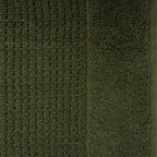 Close-up of khaki Fieldcrest Marney textured hand towel showing the raised woven pattern and soft cotton pile.