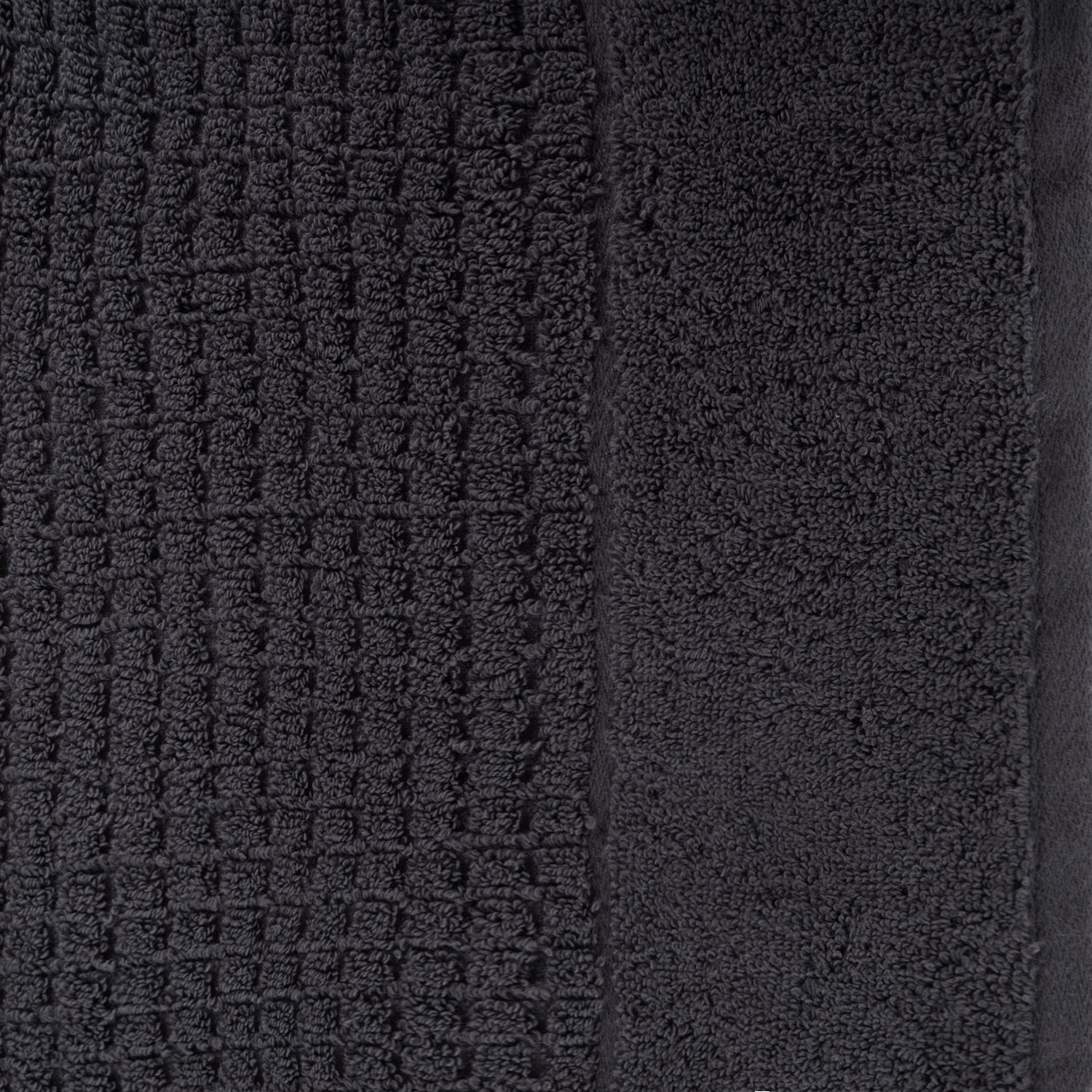 Close-up of charcoal Fieldcrest Marney textured hand towel showing the raised woven pattern and soft cotton pile.