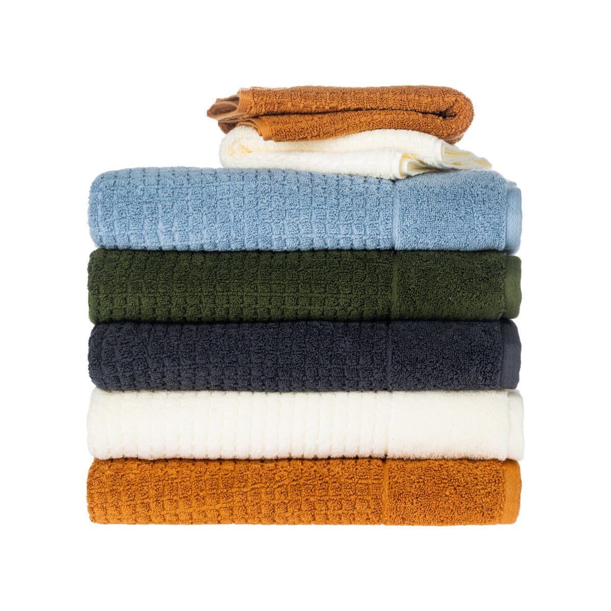 Stack of Fieldcrest Marney textured towels with caramel and ivory face cloths on top.