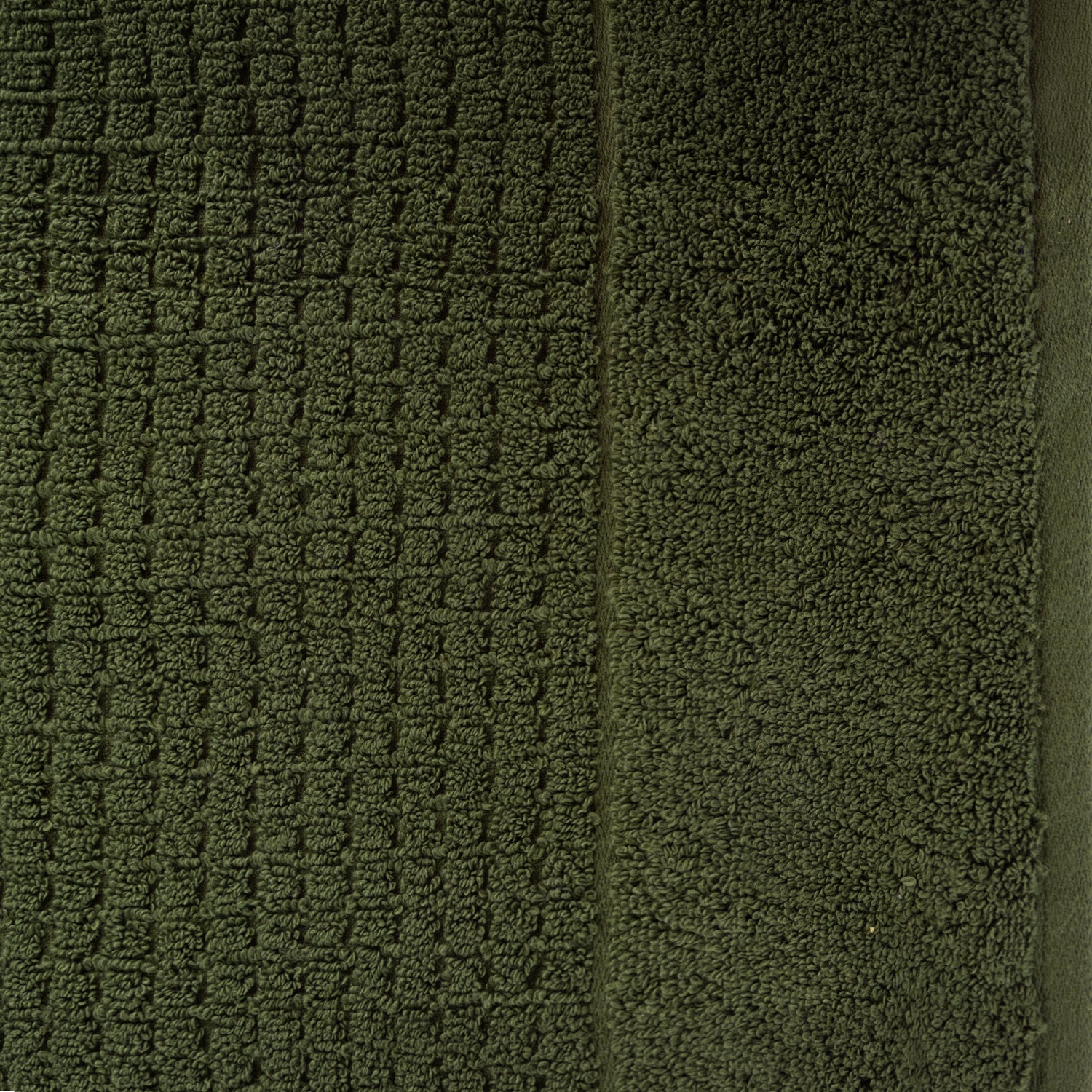 Close-up of khaki Fieldcrest Marney textured hand towel showing the raised woven pattern and soft cotton pile.
