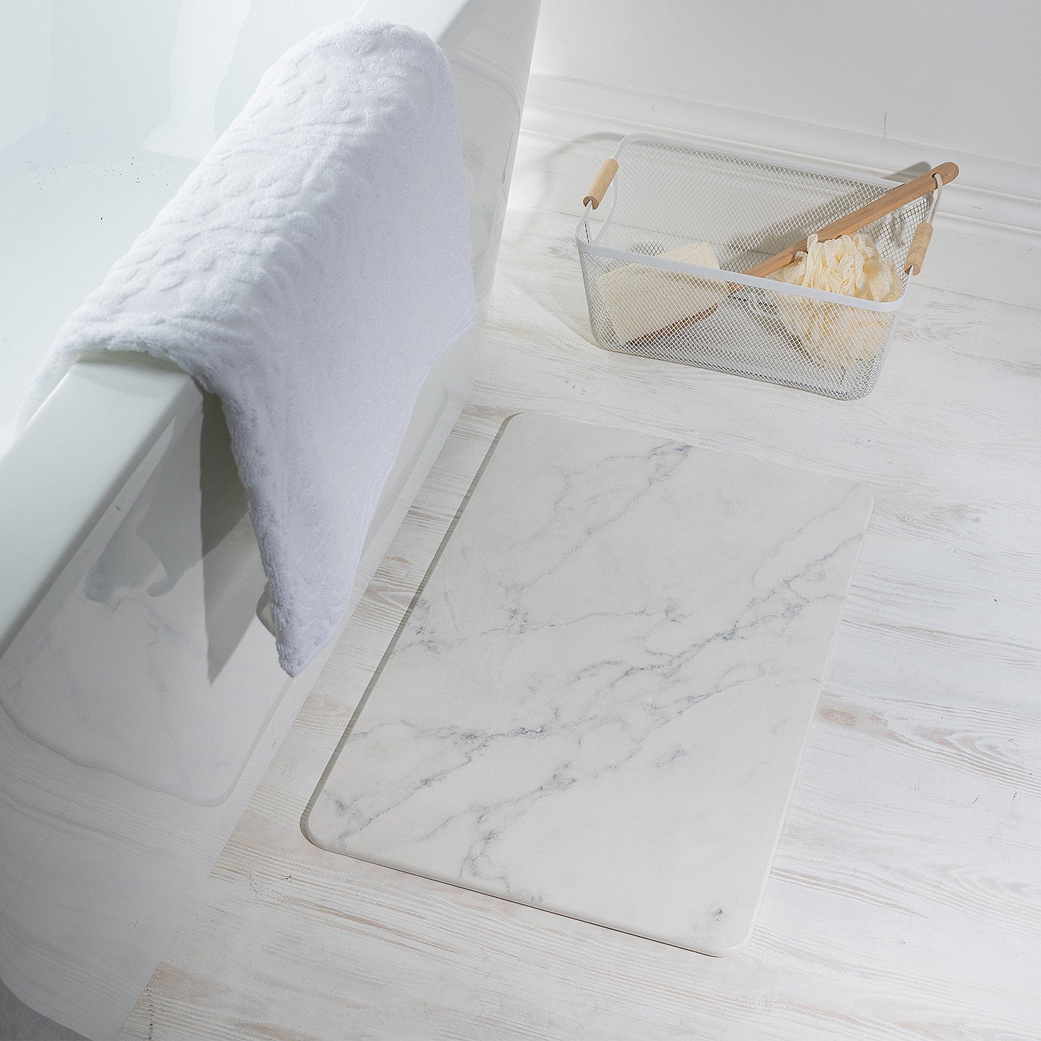 Marble quick dry Stone bathmat featuring a modern geometric pattern, styled beside a bathtub in a bright contemporary bathroom setting.