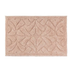 Blush rectangular bath mat with a soft plush finish and raised floral pattern.