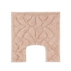 Blush toilet contour mat with a soft plush finish and raised floral pattern.