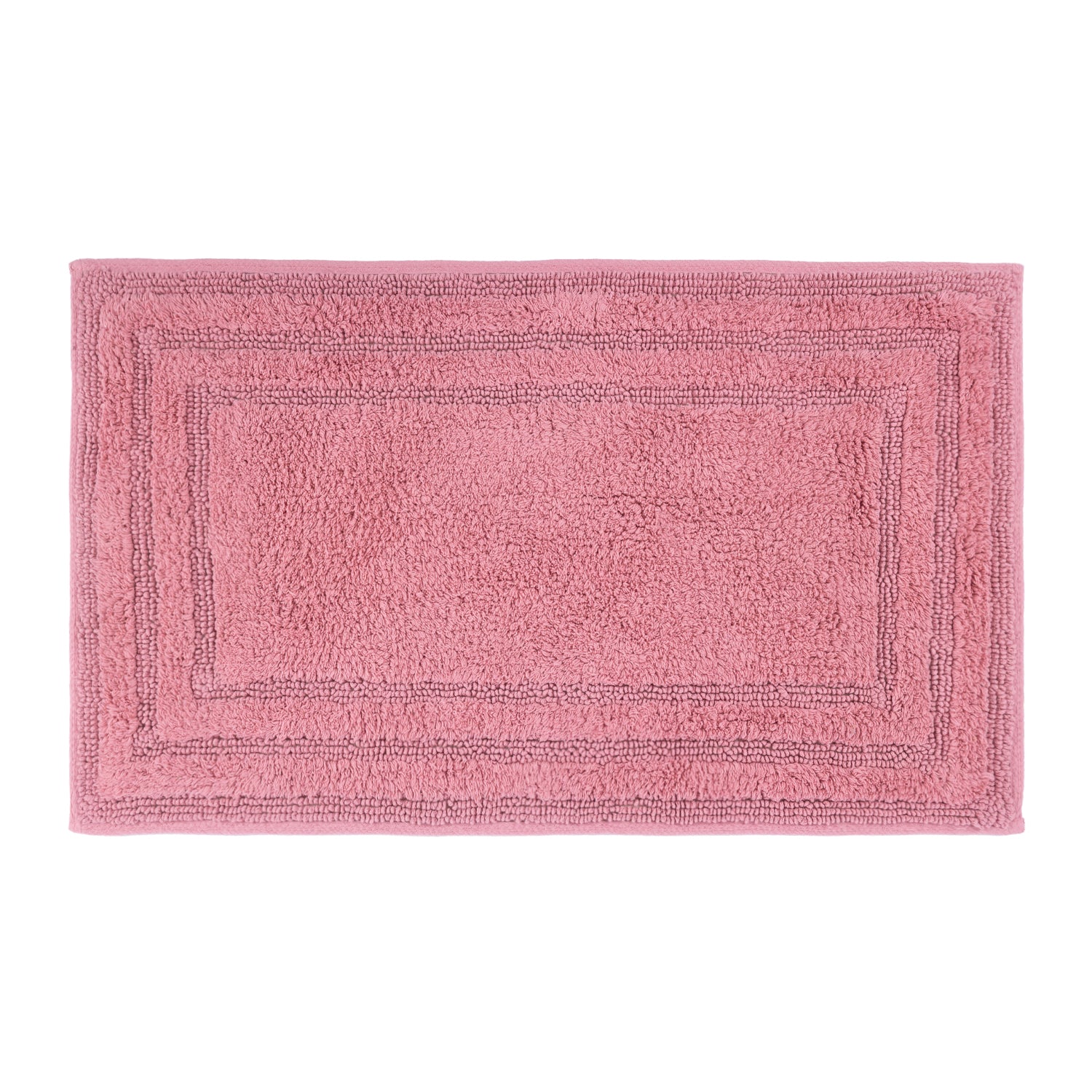 Blush rectangular bath mat with a plush textured surface and layered border detailing.