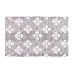 Design Republique Venica Chenille Bathmat in Taupe, featuring a soft textured finish with a contrasting white floral pattern.