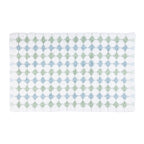 A white textured bobble bathmat featuring alternating rows of sea mist green and light blue diamond patterns against a plain white background.