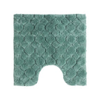 Solace Pebble Contour Mat in Eucalyptus with a soft raised pebble-inspired pattern and U-shaped cut-out.