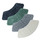 Solace Pebble Curved Shower Mat range displayed in Ebony, Eucalyptus, Grey and Cream, each featuring a plush raised pebble-inspired texture and curved shape.