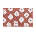 Dusky Pink bathmat featuring a white daisy floral design on a soft textured surface against a clean white background.