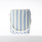 A stripe print cooler duffle bag with a white strap stands against a white background.
