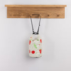 Seaside Supplies Waterproof Beach Bag 5.8L Fruit Mix Lemon featuring a cream background decorated with red cherries, strawberries, green leaves and small hearts.