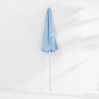 Seaside Supplies Blue Beach Umbrella featuring a folded light blue canopy and white pole, displayed upright against a white background.