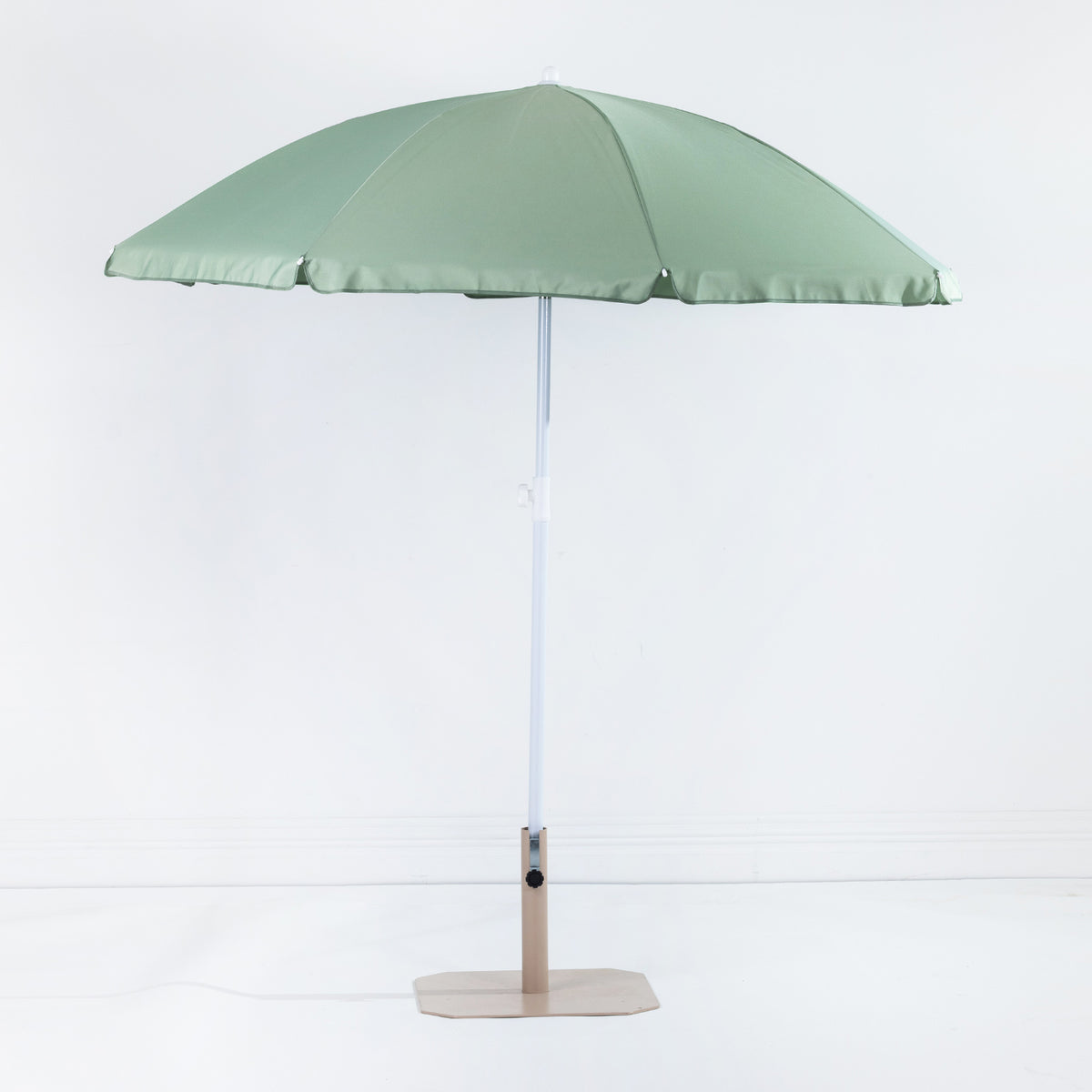 Seaside Supplies Olive Beach Umbrella featuring an open sage green canopy with a white adjustable pole and beige display stand against a white background.