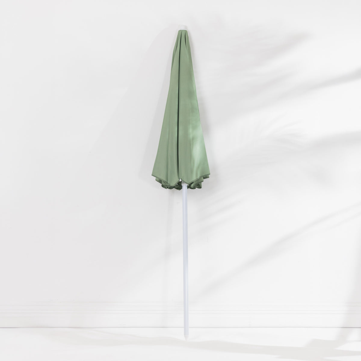 Seaside Supplies Olive Beach Umbrella featuring a folded sage green canopy and white pole, displayed upright against a white background.