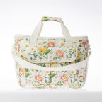 A floral print cooler bag on a white background.