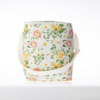 A floral print cooler duffle bag with a white strap stands against a white background.