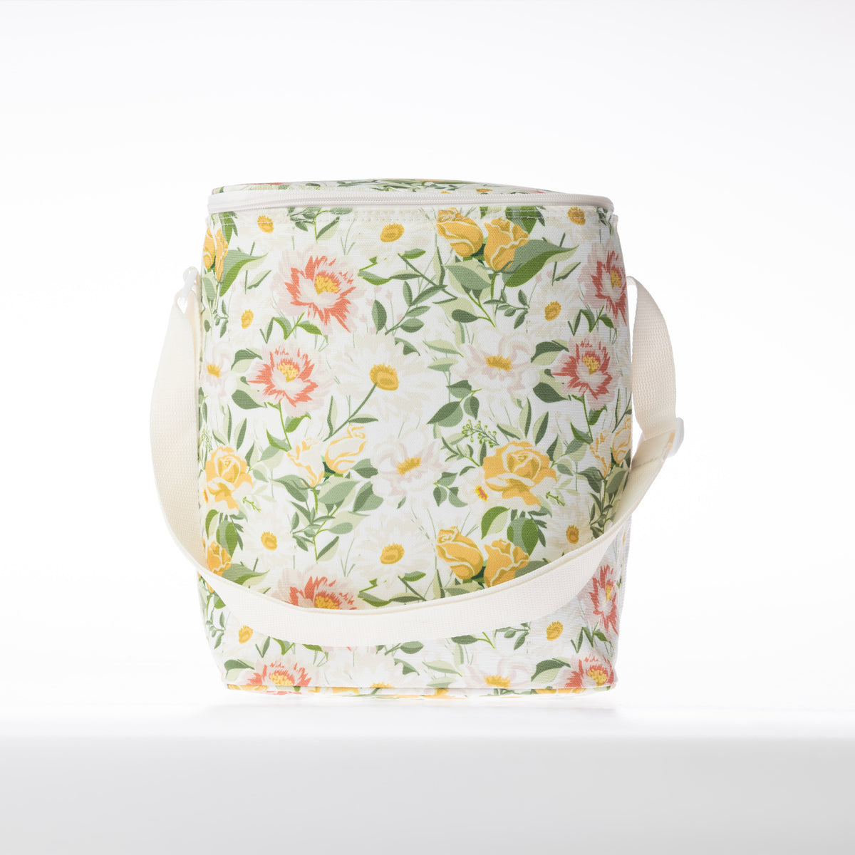 A floral print cooler duffle bag with a white strap stands against a white background.