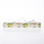A rolled-up picnic mat on a white background.