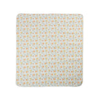 A flat lay view of a printed picnic mat