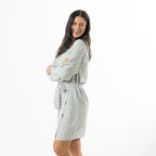 Model wearing the Marlo Contrast Viscose Printed Bathrobe in green, styled open to show the relaxed drape and contrast trim details.