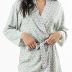 Close-up of the Marlo green printed robe showing the delicate floral pattern and contrast piping detail.