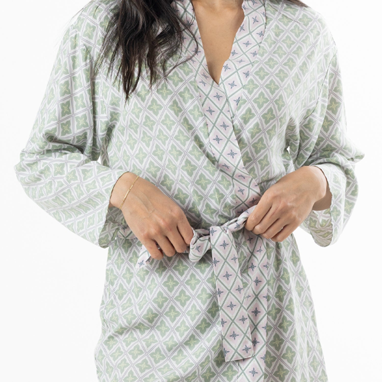 Close-up of the Marlo green printed robe showing the delicate floral pattern and contrast piping detail.