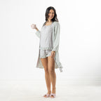 Model wearing the Marlo green printed viscose robe from the side, showing the relaxed fit and long sleeves.