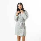 Close-up of the robe waist showing the coordinating tie belt and lightweight printed viscose fabric.